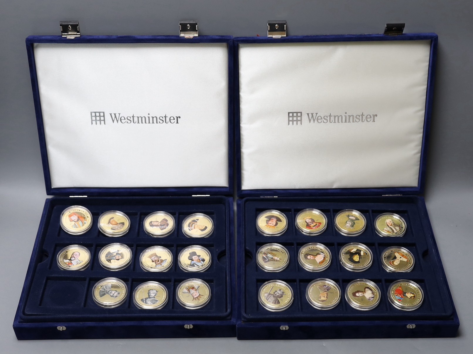 Two sets of Westminster coins in blue cases